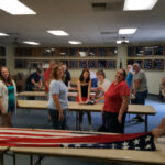 Folding the flags at the end 2016 July 4th.