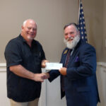 W.B. Hal Cottrell presenting a check to W.B. Steve Barchus, Nebraska Masonic Home Foundation Director