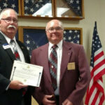 Worshipful Brother Eric Siburg receives his 50 year pin from M.W.Br Dennis Rix